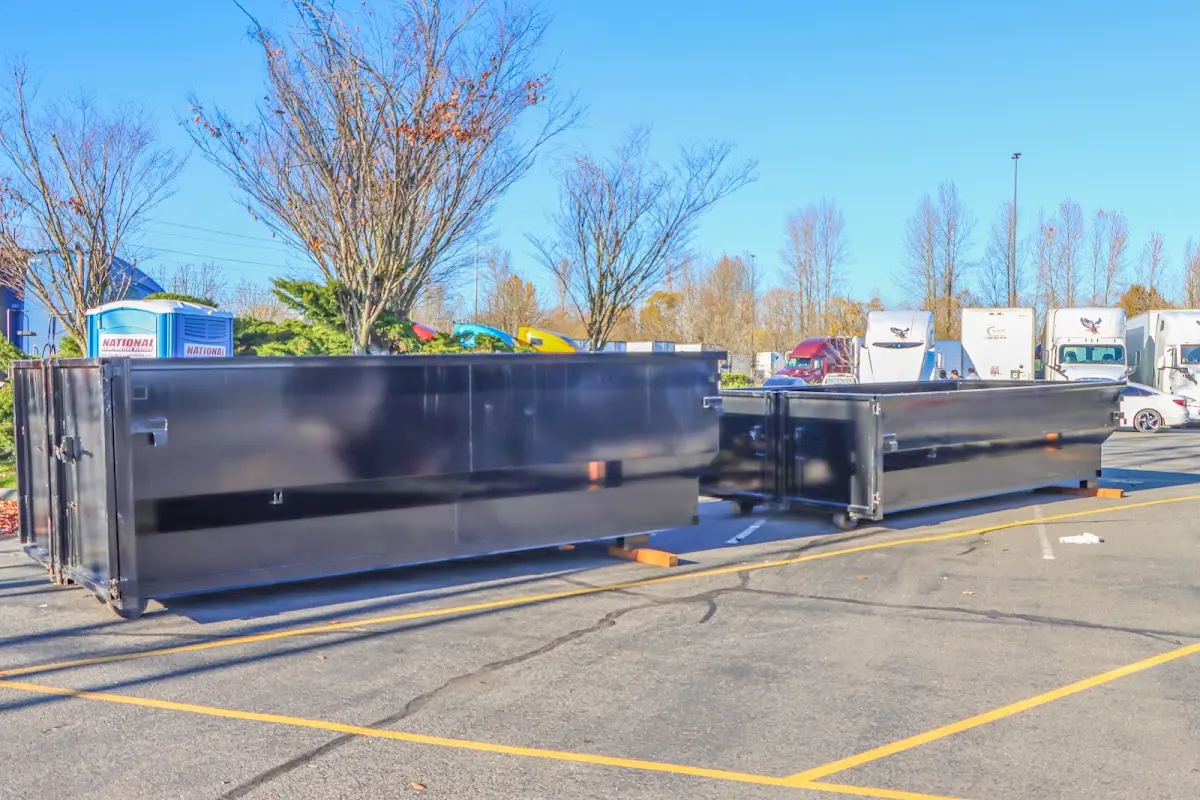 Professional dumpster rental service with roll-off container on residential driveway in Dardenne Prairie